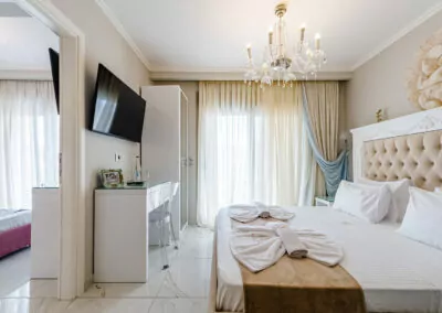 Modern luxury suite bedroom with sea view balcony at Alpha Luxury Suites Pefkohori Halkidiki