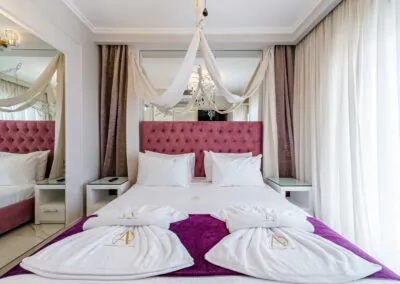 Modern luxury suite bedroom with sea view balcony at Alpha Luxury Suites Pefkohori Halkidiki