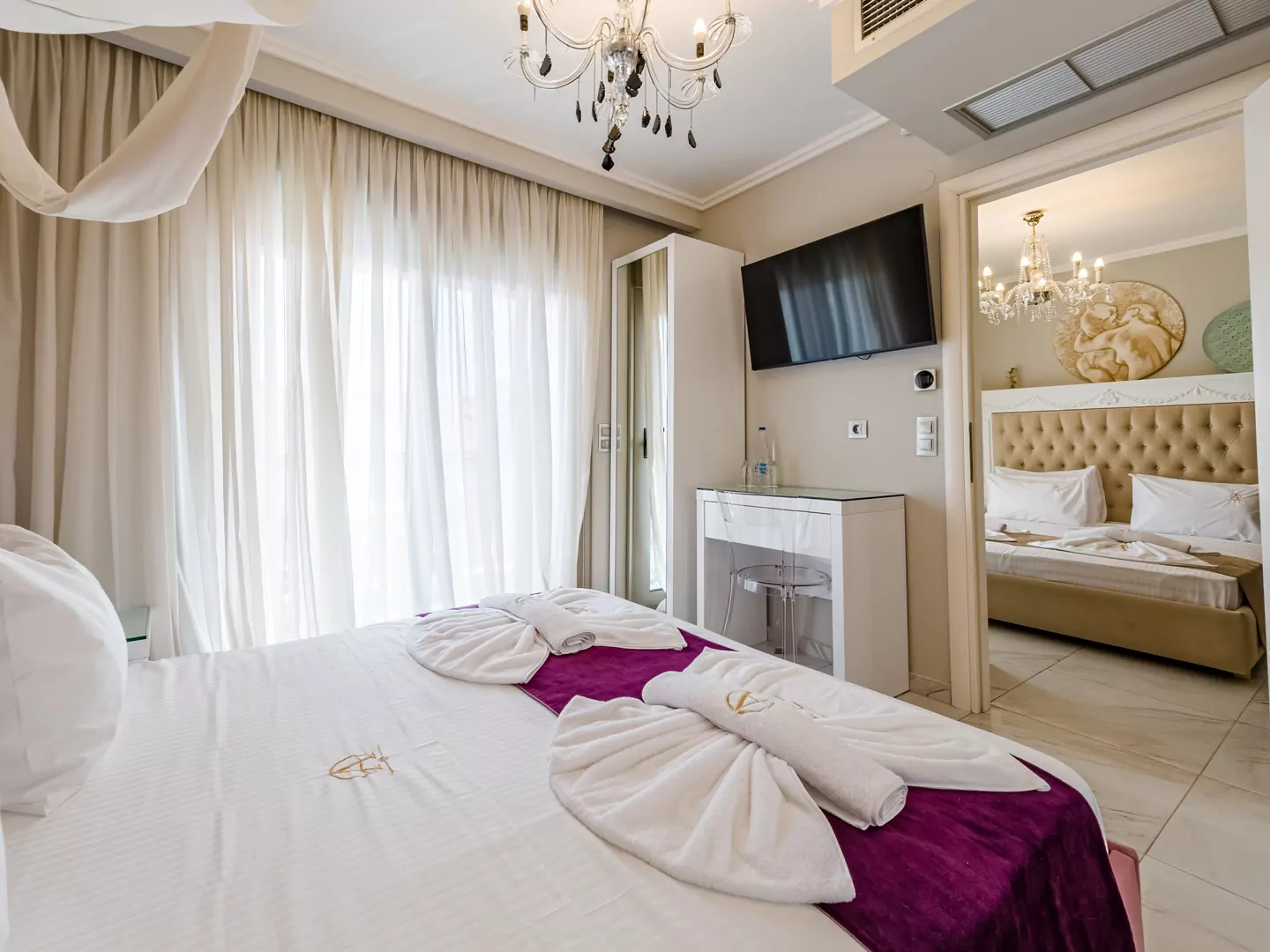 Modern luxury suite bedroom with sea view balcony at Alpha Luxury Suites Pefkohori Halkidiki