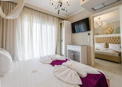 Modern luxury suite bedroom with sea view balcony at Alpha Luxury Suites Pefkohori Halkidiki