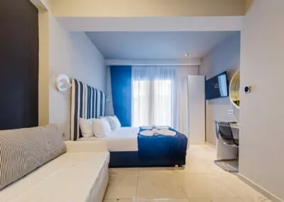 Modern luxury suite bedroom with sea view balcony at Alpha Luxury Suites Pefkohori Halkidiki