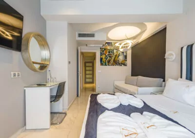 Modern luxury suite bedroom with sea view balcony at Alpha Luxury Suites Pefkohori Halkidiki
