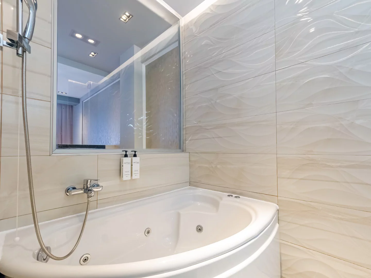 A bright and elegant room at Alpha Luxury Suites, featuring high-quality bedding, modern decor, and a private balcony overlooking the Aegean Sea. Perfect for a romantic getaway in Pefkohori.