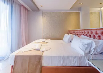 Modern luxury suite bedroom with sea view balcony at Alpha Luxury Suites Pefkohori Halkidiki