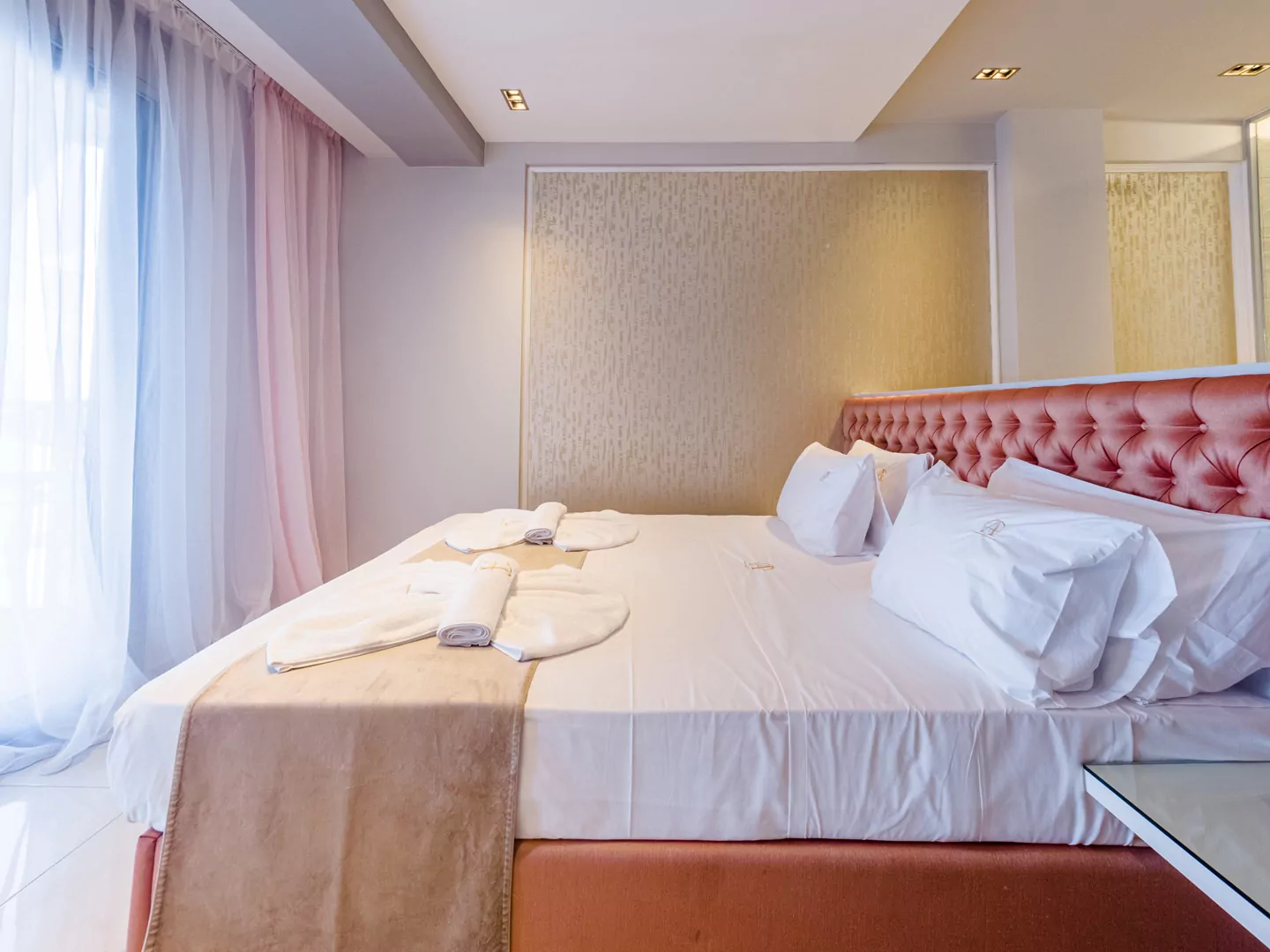 Modern luxury suite bedroom with sea view balcony at Alpha Luxury Suites Pefkohori Halkidiki