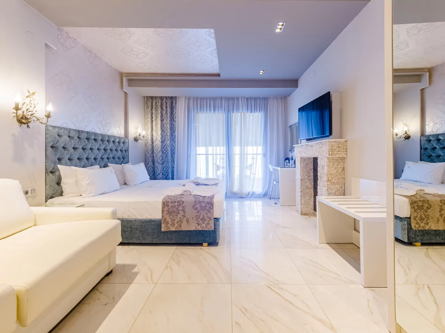 Modern luxury suite bedroom with sea view balcony at Alpha Luxury Suites Pefkohori Halkidiki