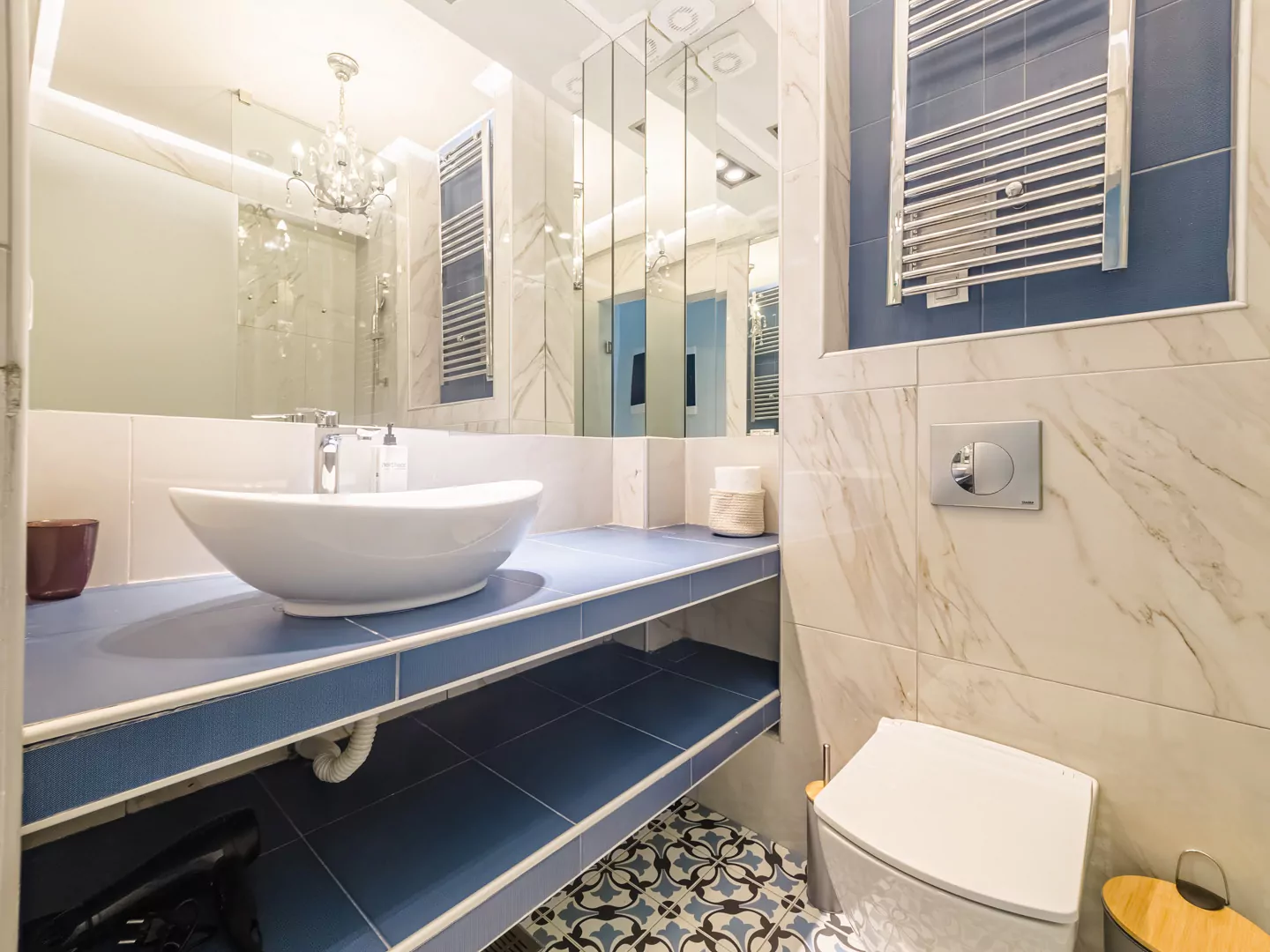 Spacious and clean bathroom design with marble finishes, high-tech fixtures, and premium toiletries for a spa-like experience.