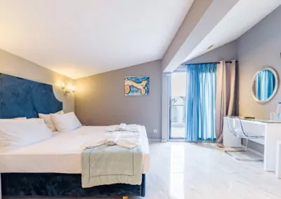 Modern luxury suite bedroom with sea view balcony at Alpha Luxury Suites Pefkohori Halkidiki
