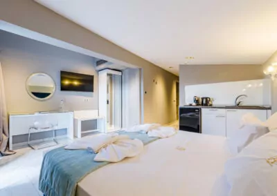 Modern luxury suite bedroom with sea view balcony at Alpha Luxury Suites Pefkohori Halkidiki