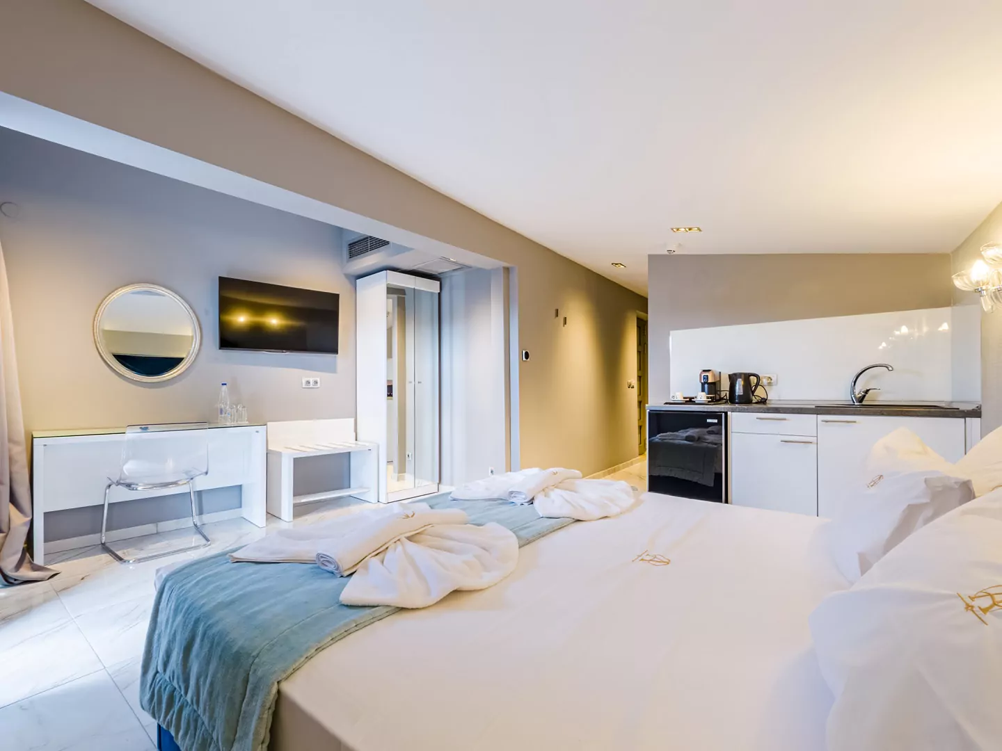 Modern luxury suite bedroom with sea view balcony at Alpha Luxury Suites Pefkohori Halkidiki