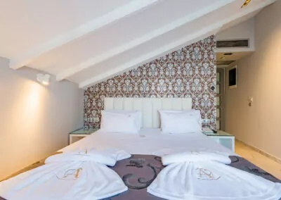 Modern luxury suite bedroom with sea view balcony at Alpha Luxury Suites Pefkohori Halkidiki
