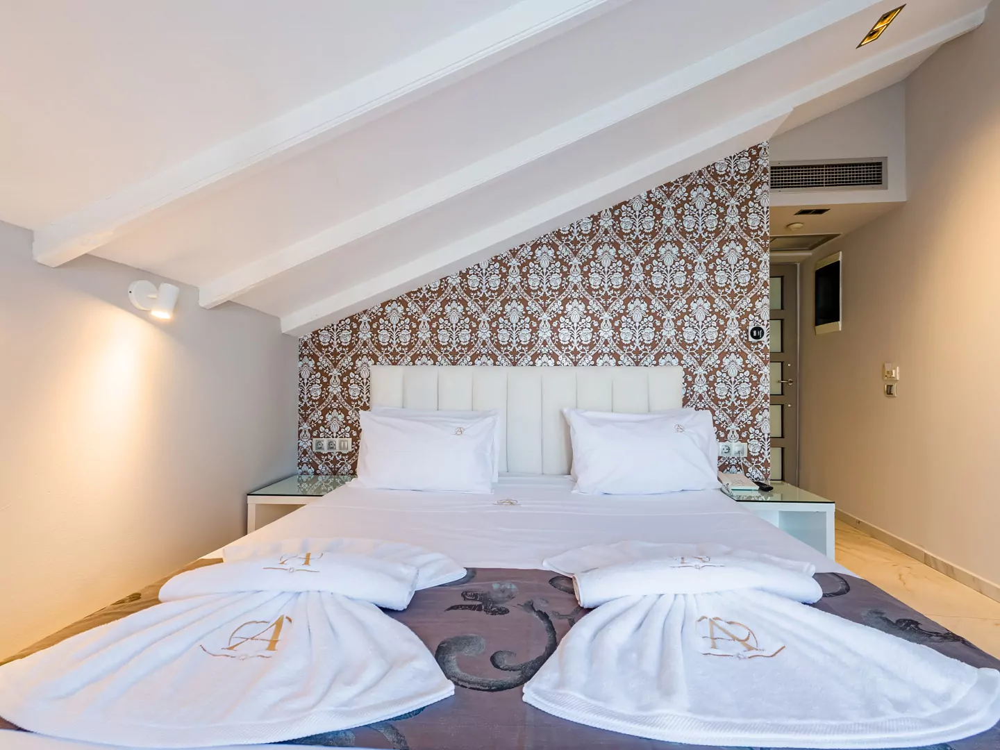 Modern luxury suite bedroom with sea view balcony at Alpha Luxury Suites Pefkohori Halkidiki
