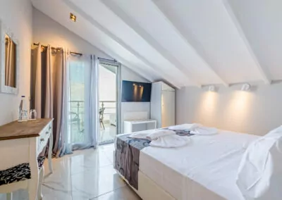 Modern luxury suite bedroom with sea view balcony at Alpha Luxury Suites Pefkohori Halkidiki