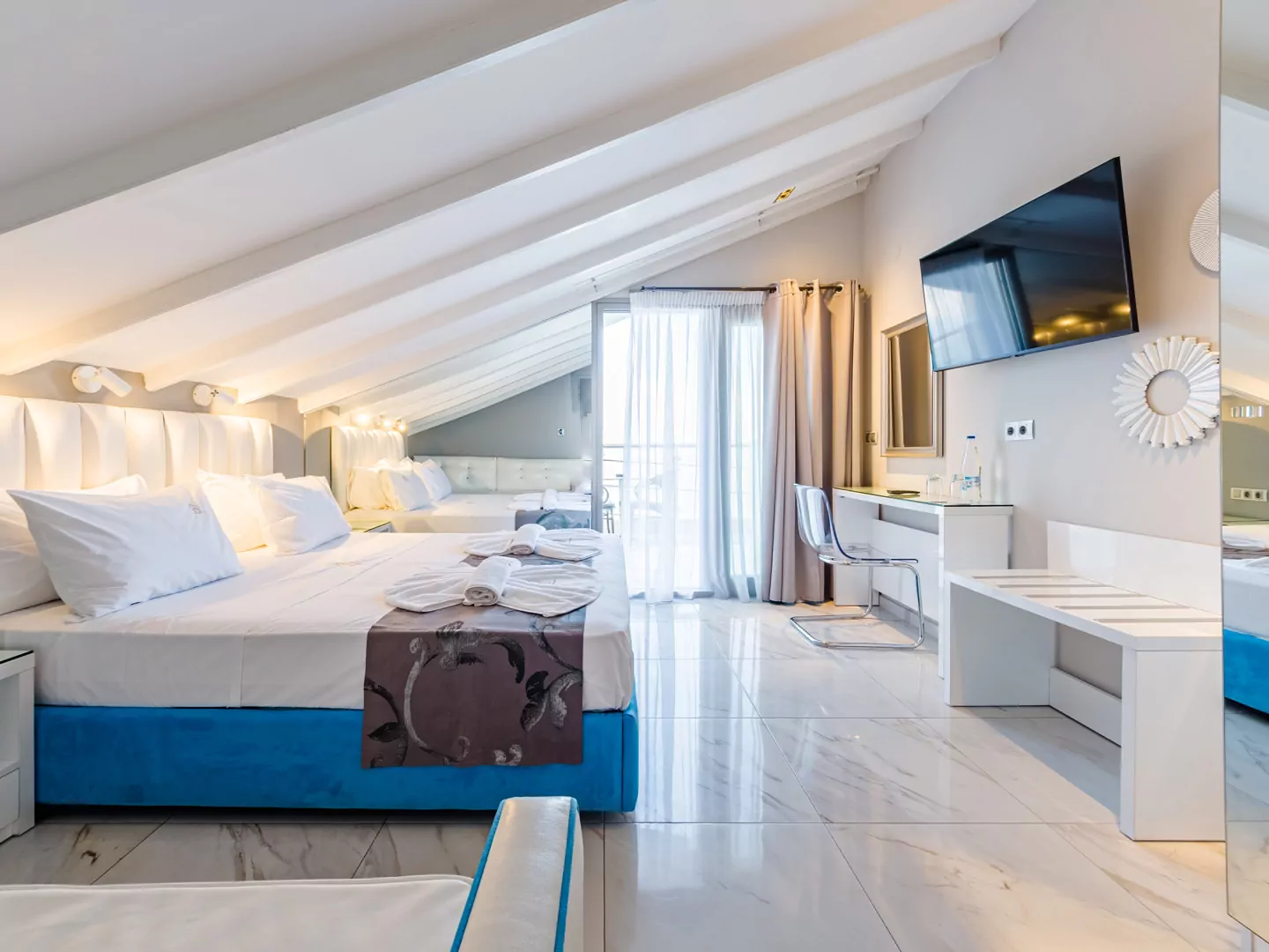 Modern luxury suite bedroom with sea view balcony at Alpha Luxury Suites Pefkohori Halkidiki
