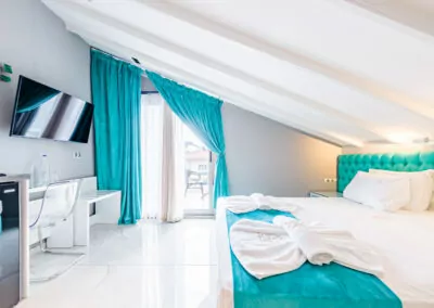 Modern luxury suite bedroom with sea view balcony at Alpha Luxury Suites Pefkohori Halkidiki