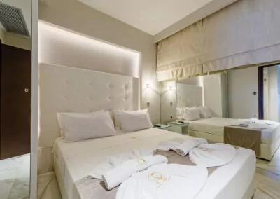 Modern luxury suite bedroom with sea view balcony at Alpha Luxury Suites Pefkohori Halkidiki