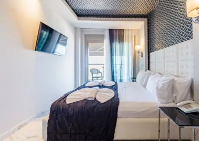 Modern luxury suite bedroom with sea view balcony at Alpha Luxury Suites Pefkohori Halkidiki