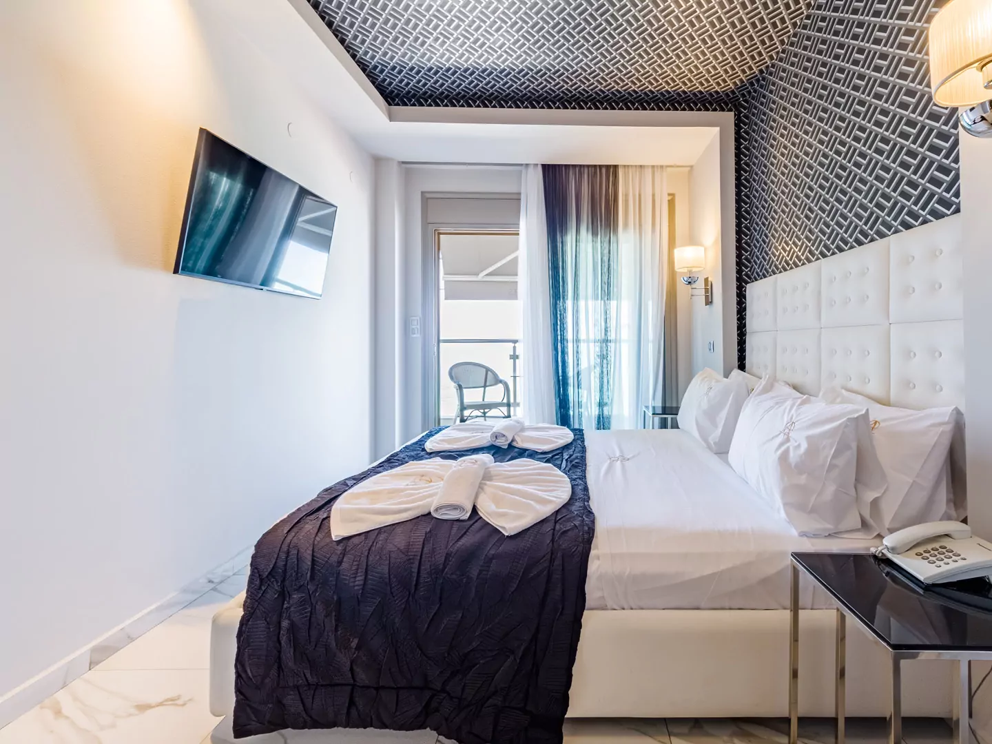 Modern luxury suite bedroom with sea view balcony at Alpha Luxury Suites Pefkohori Halkidiki
