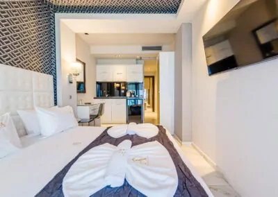 Modern luxury suite bedroom with sea view balcony at Alpha Luxury Suites Pefkohori Halkidiki
