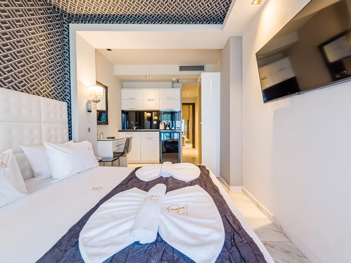 Modern luxury suite bedroom with sea view balcony at Alpha Luxury Suites Pefkohori Halkidiki