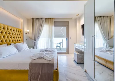 Modern luxury suite bedroom with sea view balcony at Alpha Luxury Suites Pefkohori Halkidiki