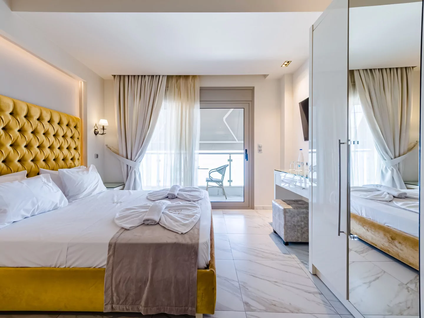 Modern luxury suite bedroom with sea view balcony at Alpha Luxury Suites Pefkohori Halkidiki