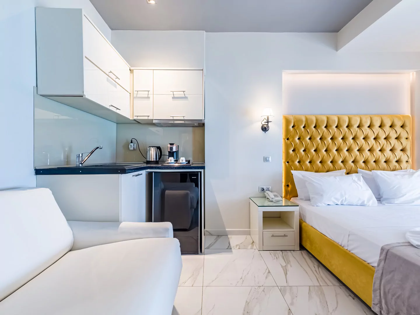 Modern luxury suite bedroom with sea view balcony at Alpha Luxury Suites Pefkohori Halkidiki