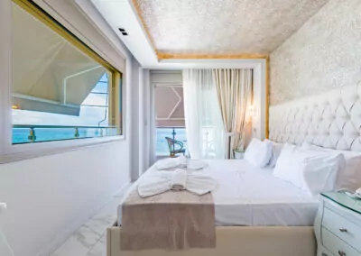 Modern luxury suite bedroom with sea view balcony at Alpha Luxury Suites Pefkohori Halkidiki