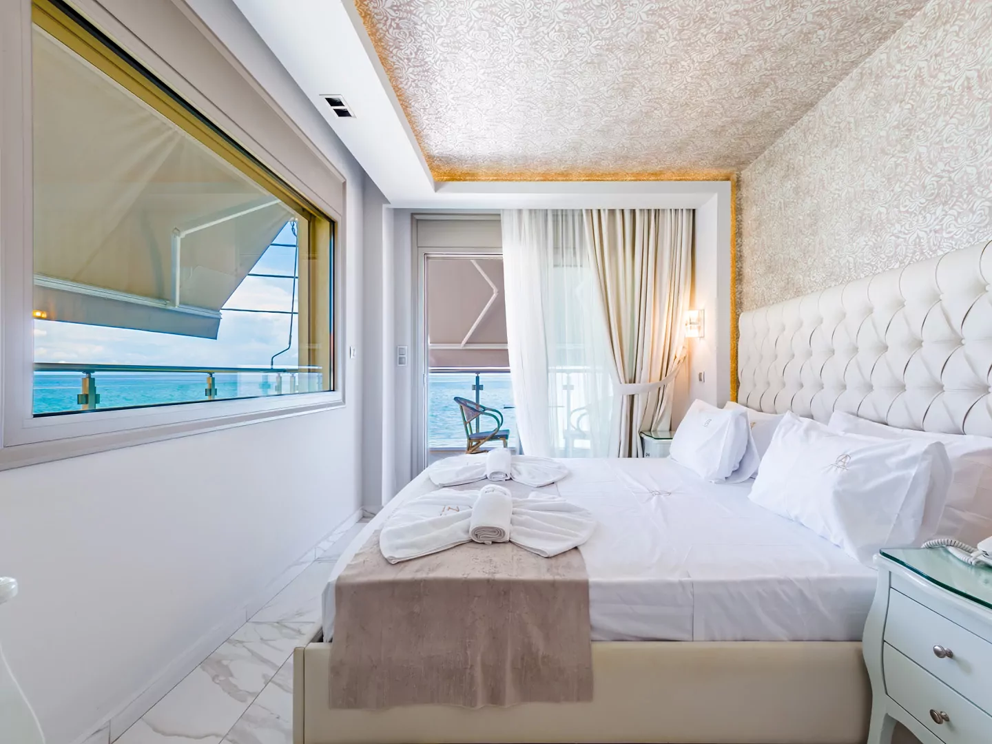 Modern luxury suite bedroom with sea view balcony at Alpha Luxury Suites Pefkohori Halkidiki