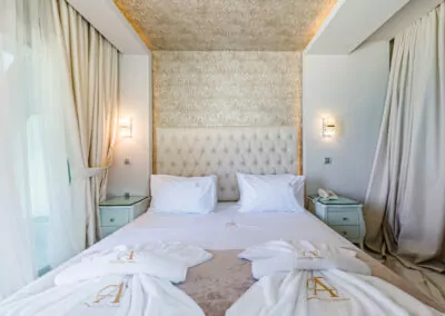 Modern luxury suite bedroom with sea view balcony at Alpha Luxury Suites Pefkohori Halkidiki