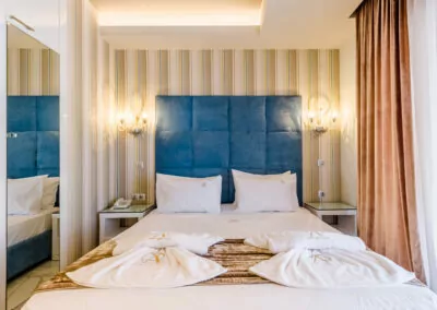 Modern luxury suite bedroom with sea view balcony at Alpha Luxury Suites Pefkohori Halkidiki