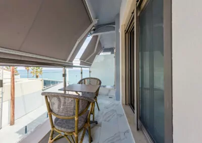 Sunset view from Alpha Luxury Suites Rooftop Bar in Pefkohori with sea view and cocktails