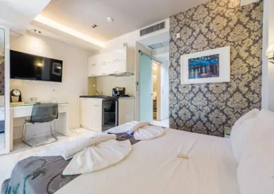Modern luxury suite bedroom with sea view balcony at Alpha Luxury Suites Pefkohori Halkidiki
