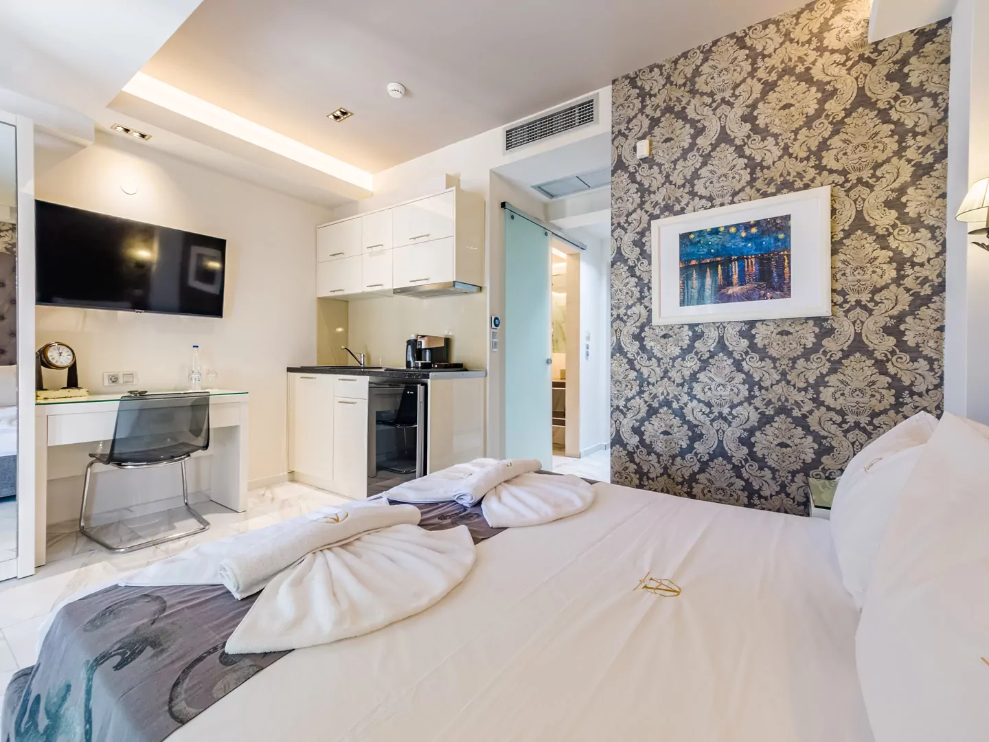 Modern luxury suite bedroom with sea view balcony at Alpha Luxury Suites Pefkohori Halkidiki