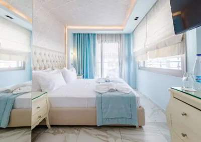 Modern luxury suite bedroom with sea view balcony at Alpha Luxury Suites Pefkohori Halkidiki
