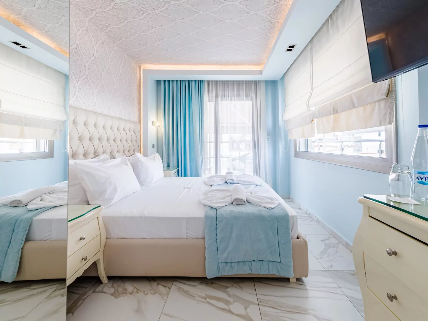 Modern luxury suite bedroom with sea view balcony at Alpha Luxury Suites Pefkohori Halkidiki