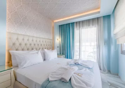 Modern luxury suite bedroom with sea view balcony at Alpha Luxury Suites Pefkohori Halkidiki