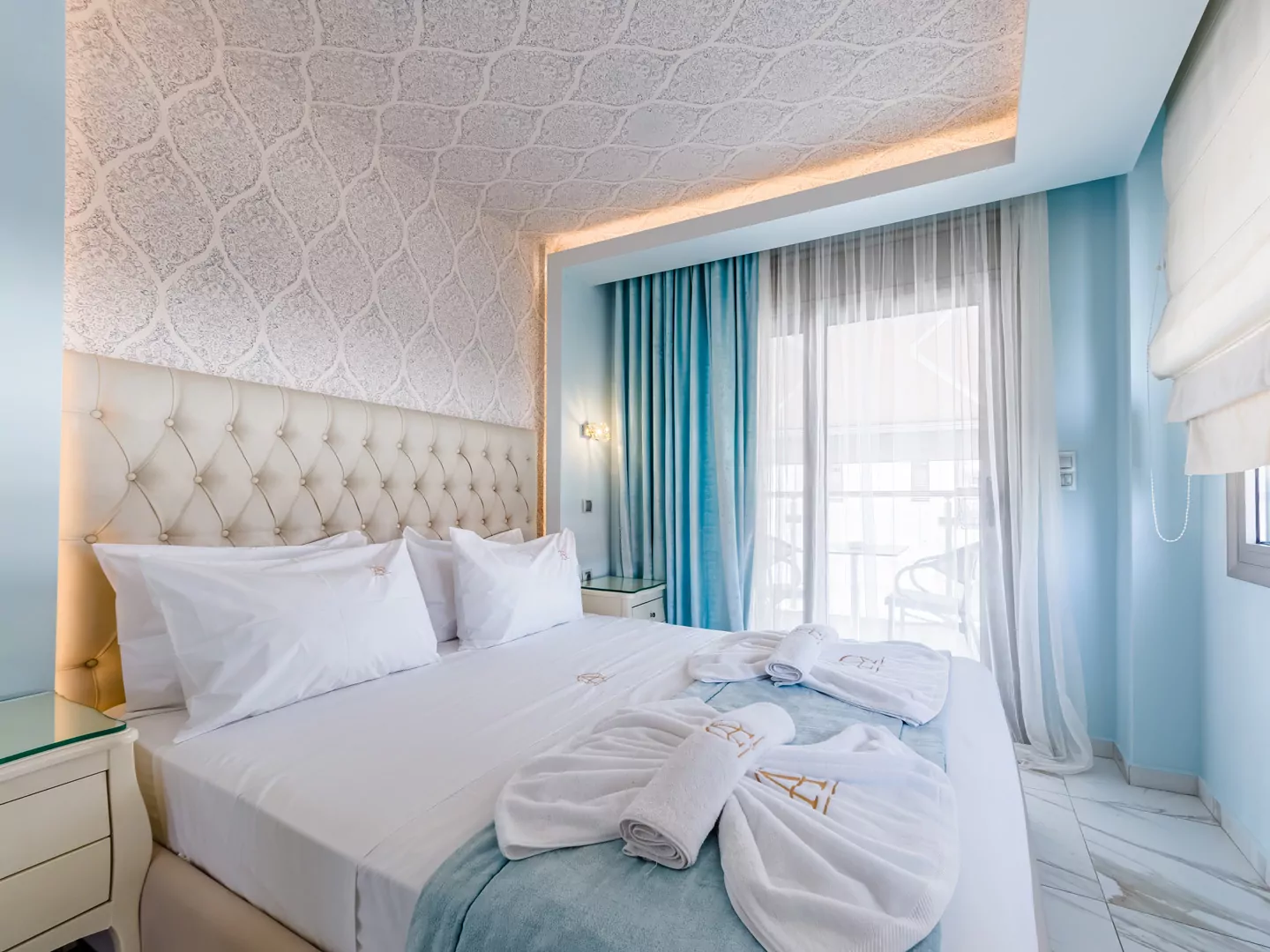 Modern luxury suite bedroom with sea view balcony at Alpha Luxury Suites Pefkohori Halkidiki