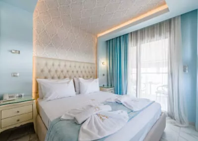 Modern luxury suite bedroom with sea view balcony at Alpha Luxury Suites Pefkohori Halkidiki
