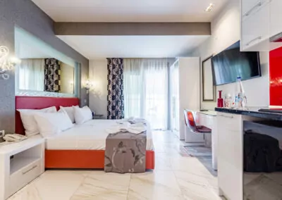Modern luxury suite bedroom with sea view balcony at Alpha Luxury Suites Pefkohori Halkidiki