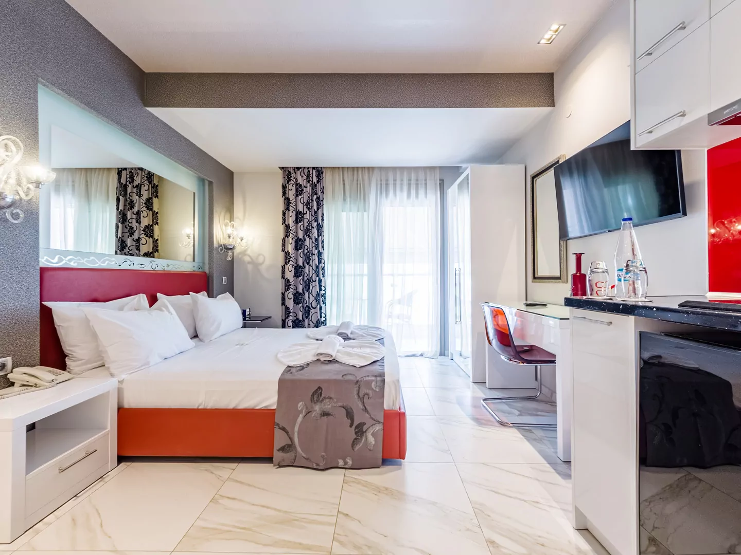 Modern luxury suite bedroom with sea view balcony at Alpha Luxury Suites Pefkohori Halkidiki