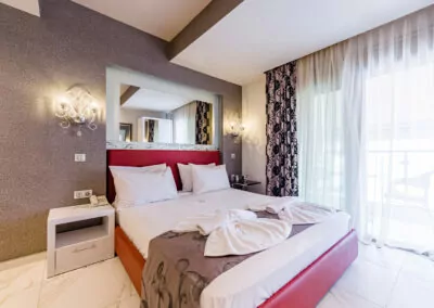 Modern luxury suite bedroom with sea view balcony at Alpha Luxury Suites Pefkohori Halkidiki