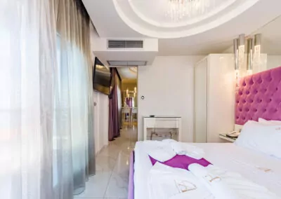 Modern luxury suite bedroom with sea view balcony at Alpha Luxury Suites Pefkohori Halkidiki