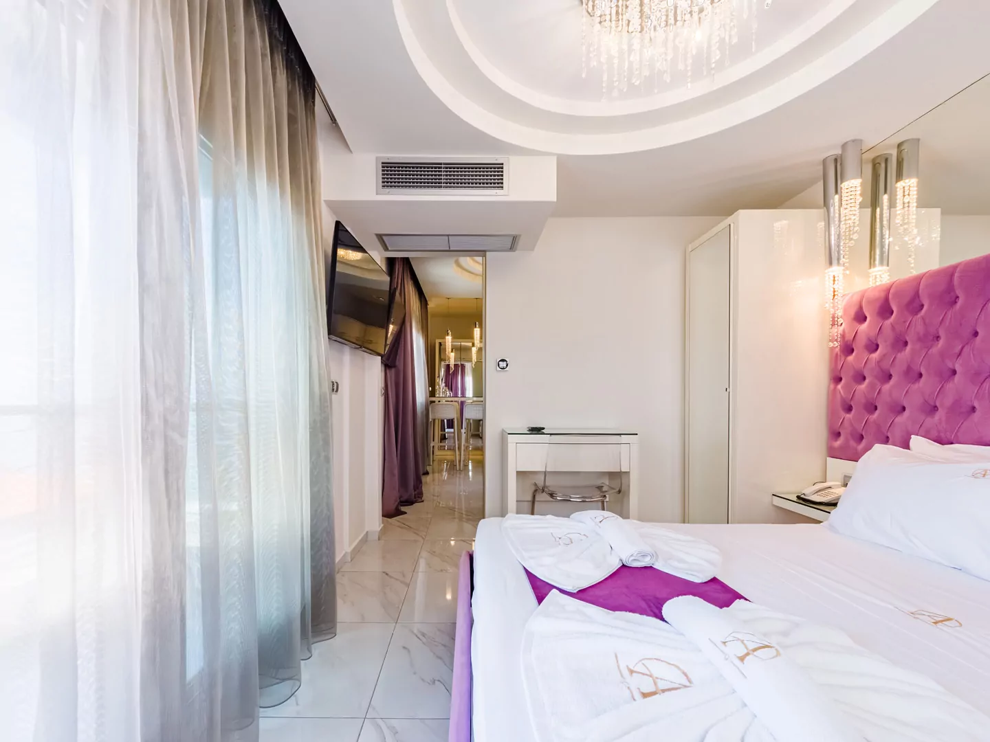 Modern luxury suite bedroom with sea view balcony at Alpha Luxury Suites Pefkohori Halkidiki