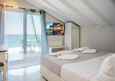 Modern luxury suite bedroom with sea view balcony at Alpha Luxury Suites Pefkohori Halkidiki