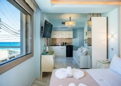 Modern luxury suite bedroom with sea view balcony at Alpha Luxury Suites Pefkohori Halkidiki