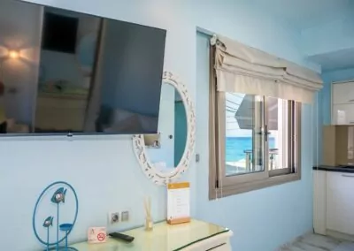Modern luxury suite bedroom with sea view balcony at Alpha Luxury Suites Pefkohori Halkidiki