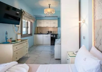 Modern luxury suite bedroom with sea view balcony at Alpha Luxury Suites Pefkohori Halkidiki
