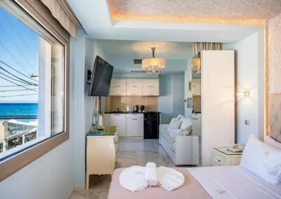 Modern luxury suite bedroom with sea view balcony at Alpha Luxury Suites Pefkohori Halkidiki